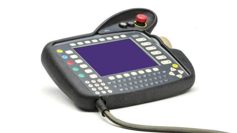 Remotely programming an industrial robot can be done using the Robot Teach Pendant; This is the most common device used to do so